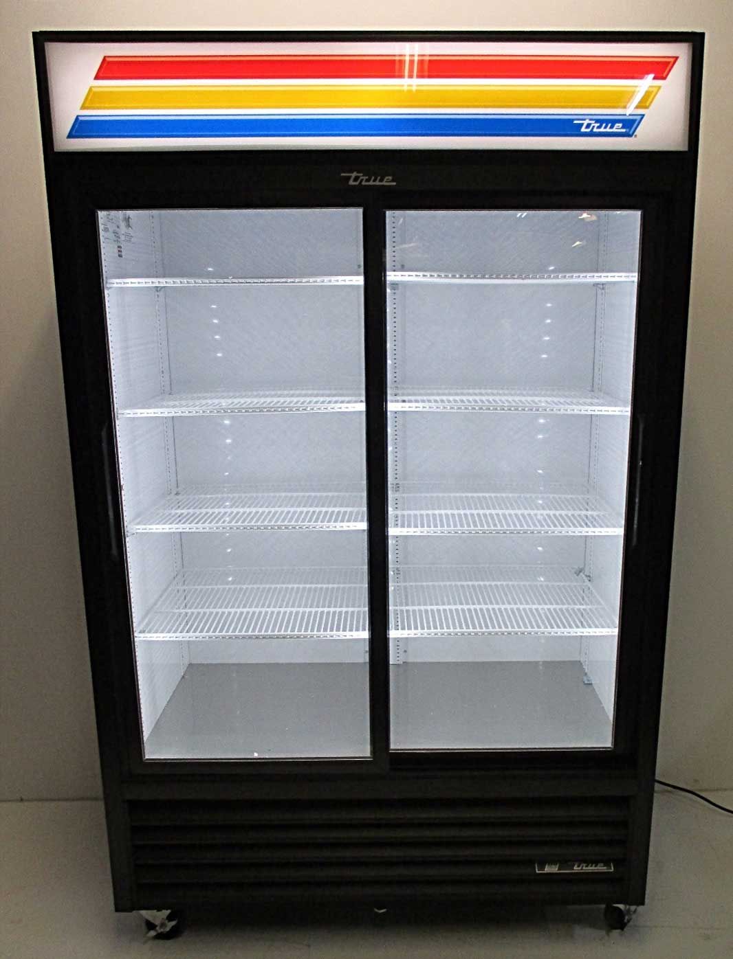 A black refrigerator with sliding glass doors and a colorful stripe on the top