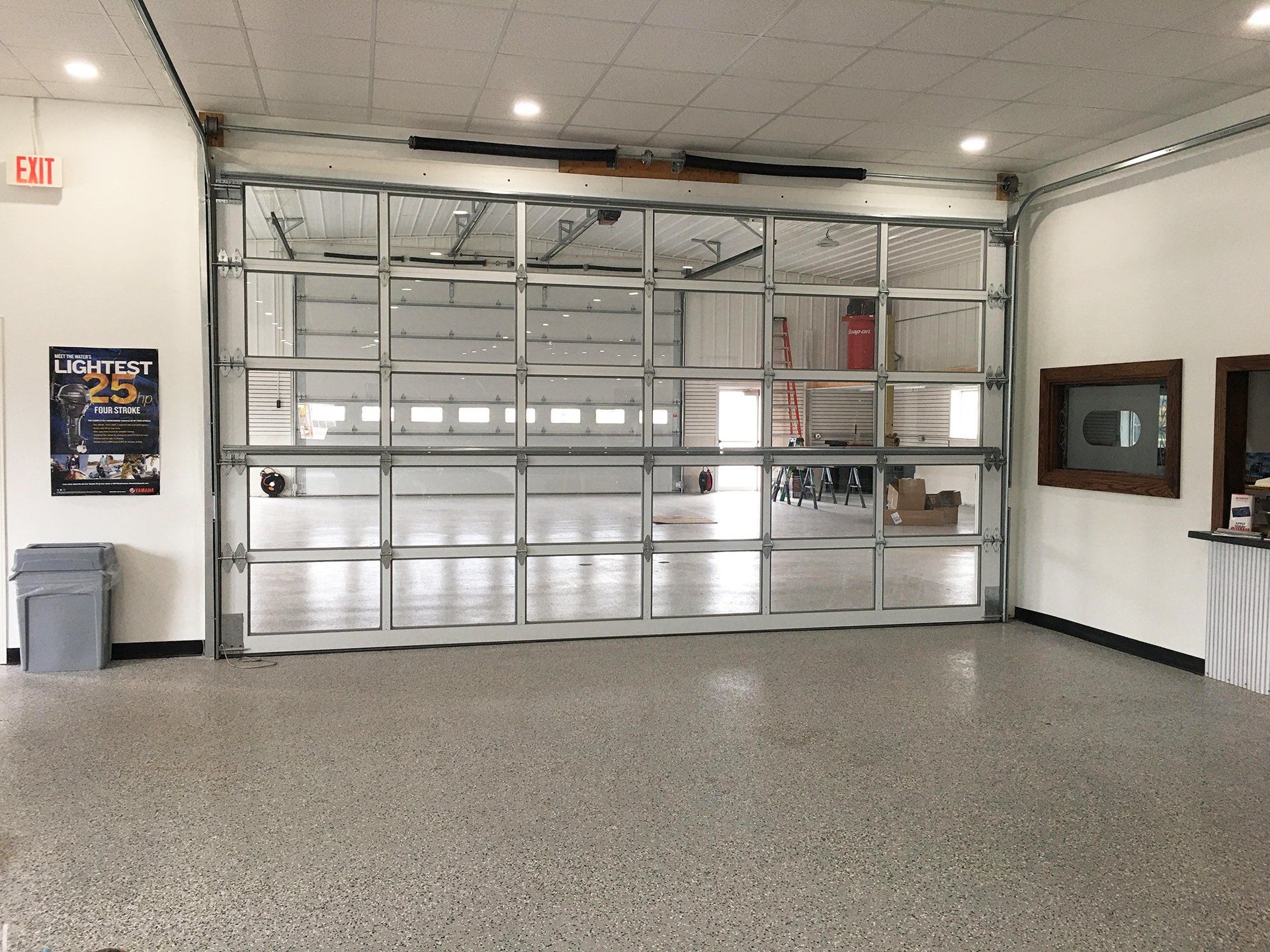 A garage with a large garage door and a sign that says exit