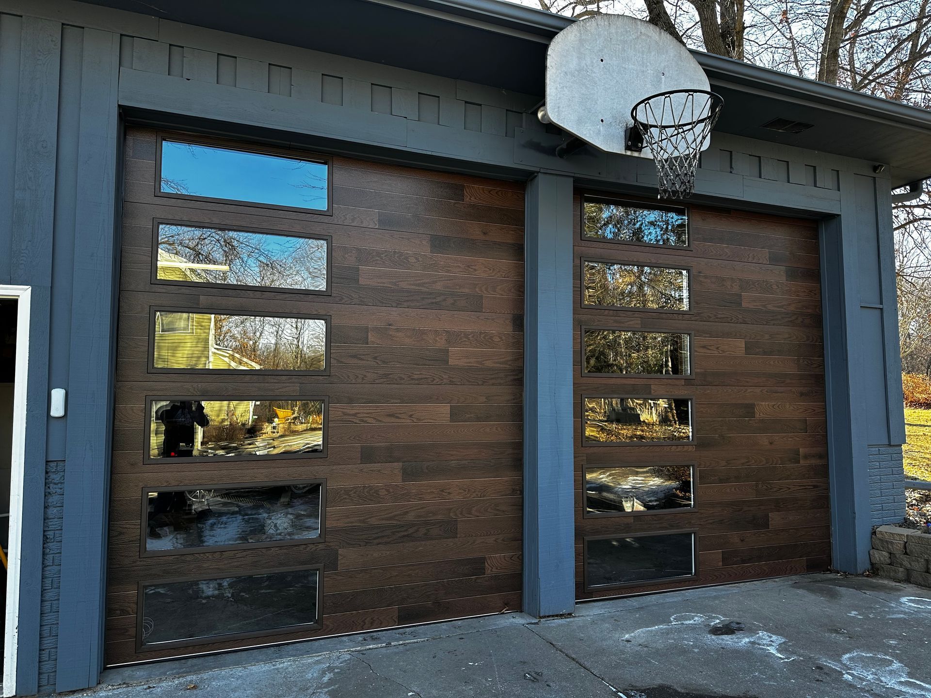 A garage door with a basketball hoop attached to it.