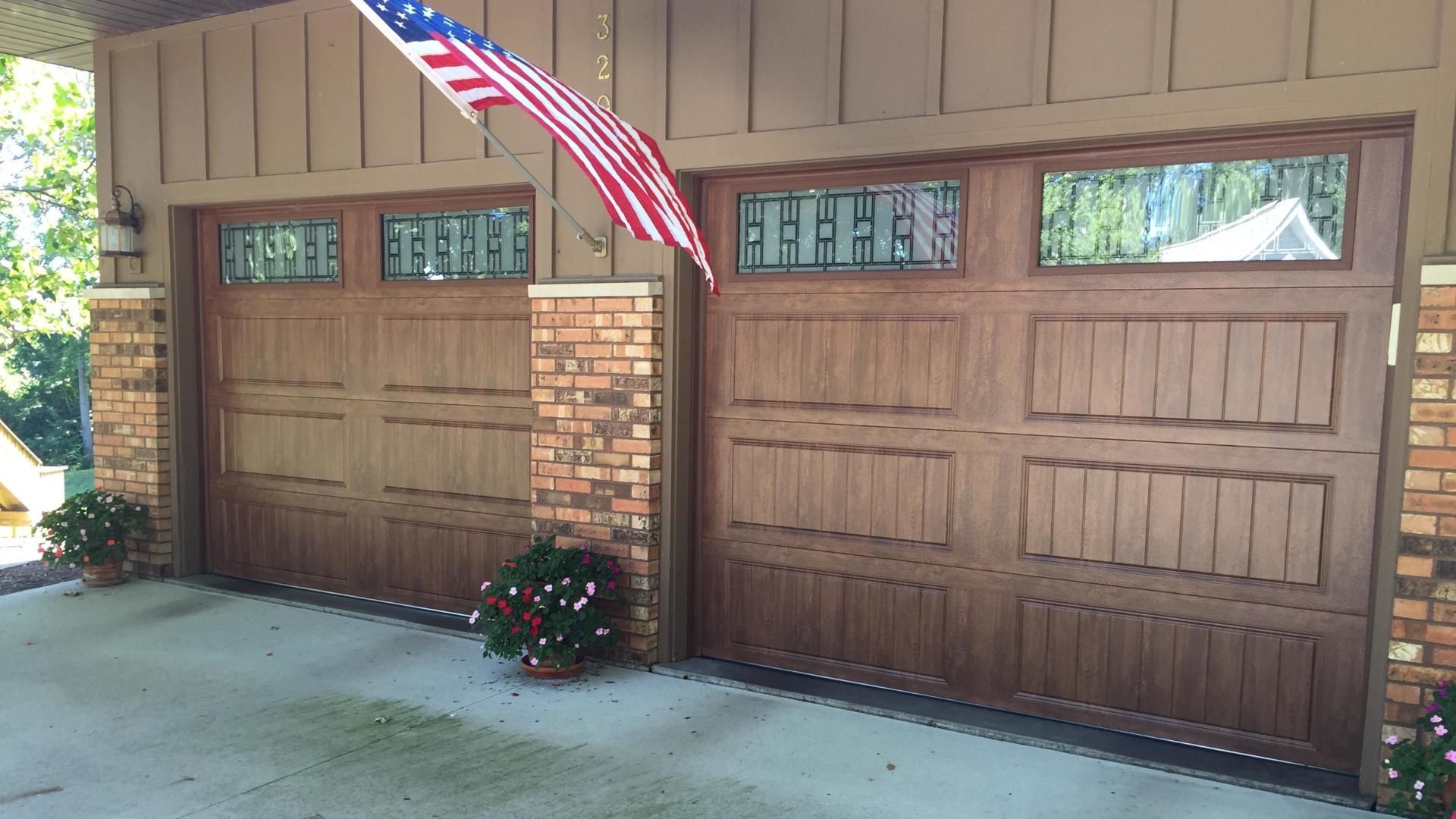 A garage door with an american flag hanging from it.