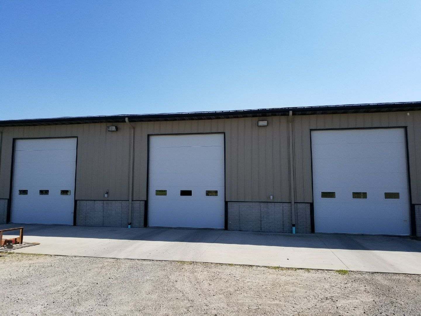 A row of garage doors on the side of a building