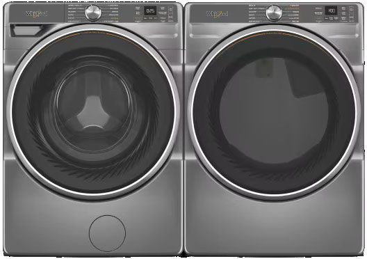 A washer and dryer are sitting next to each other on a white background.