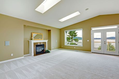 There is a fireplace in the middle of the living room.