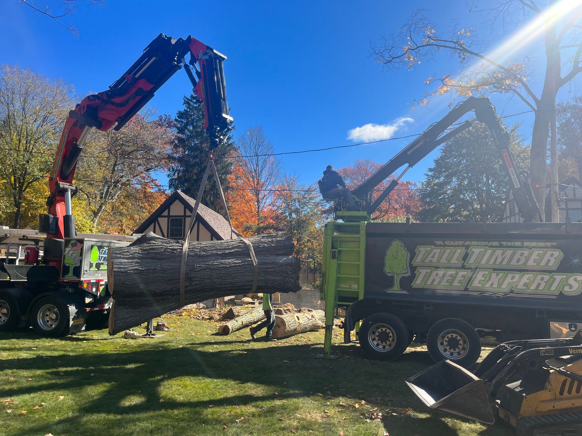 A tree cutting truck is parked on the side of the road.