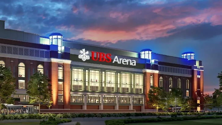 Exterior of BB&T Arena at dusk, with a crowd gathered outside and a colorful sky overhead
