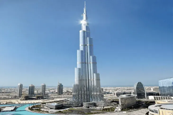 Burj Khalifa towering over Dubai skyline under a clear blue sky