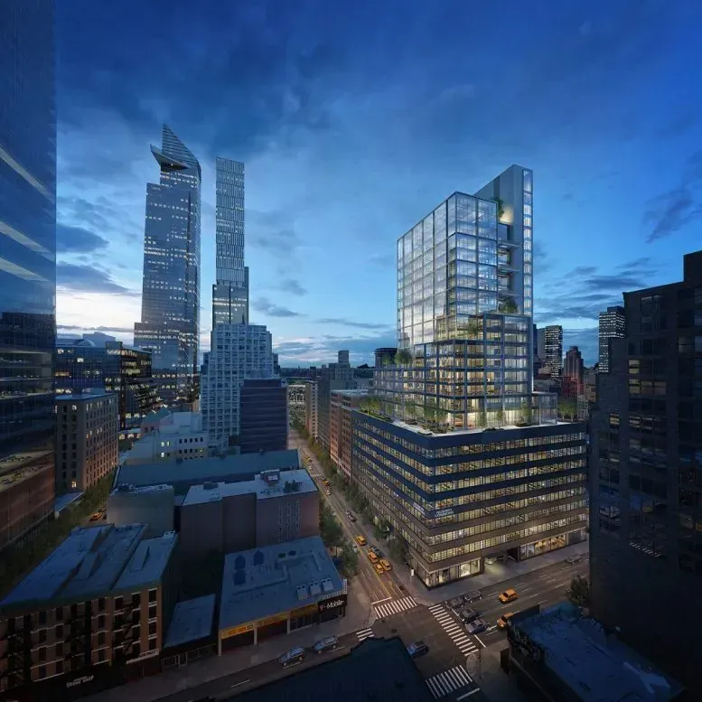 Dusk city skyline with illuminated modern glass towers and streets below