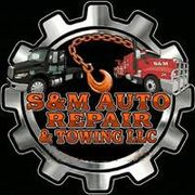 S&M Auto Repair & Towing LLC logo with black tow truck, red truck, and wrench inside a gear shape