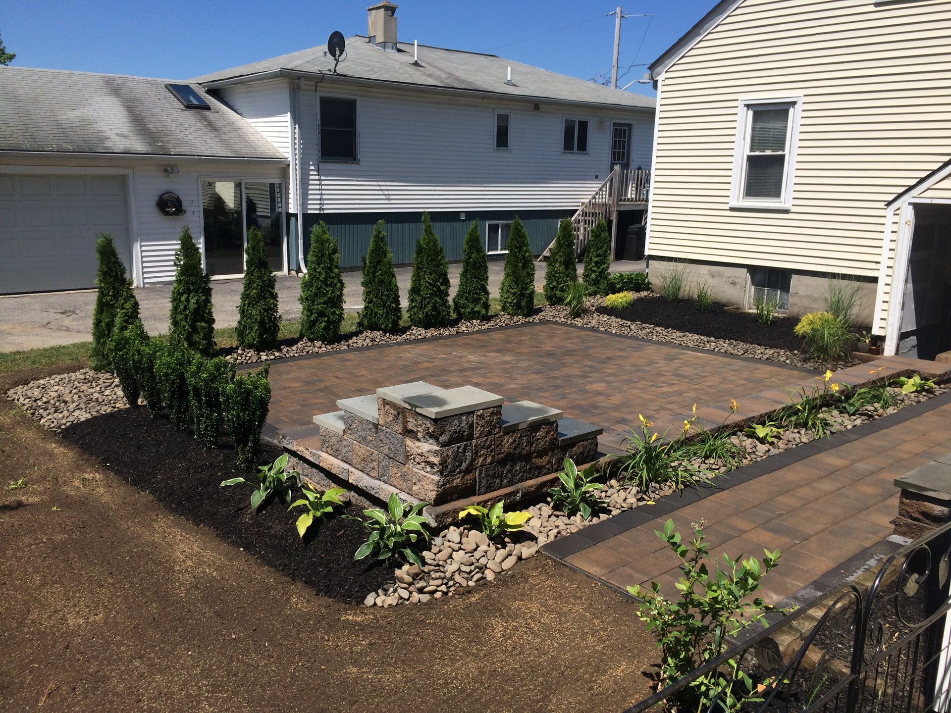 A house with a patio and trees in front of it
