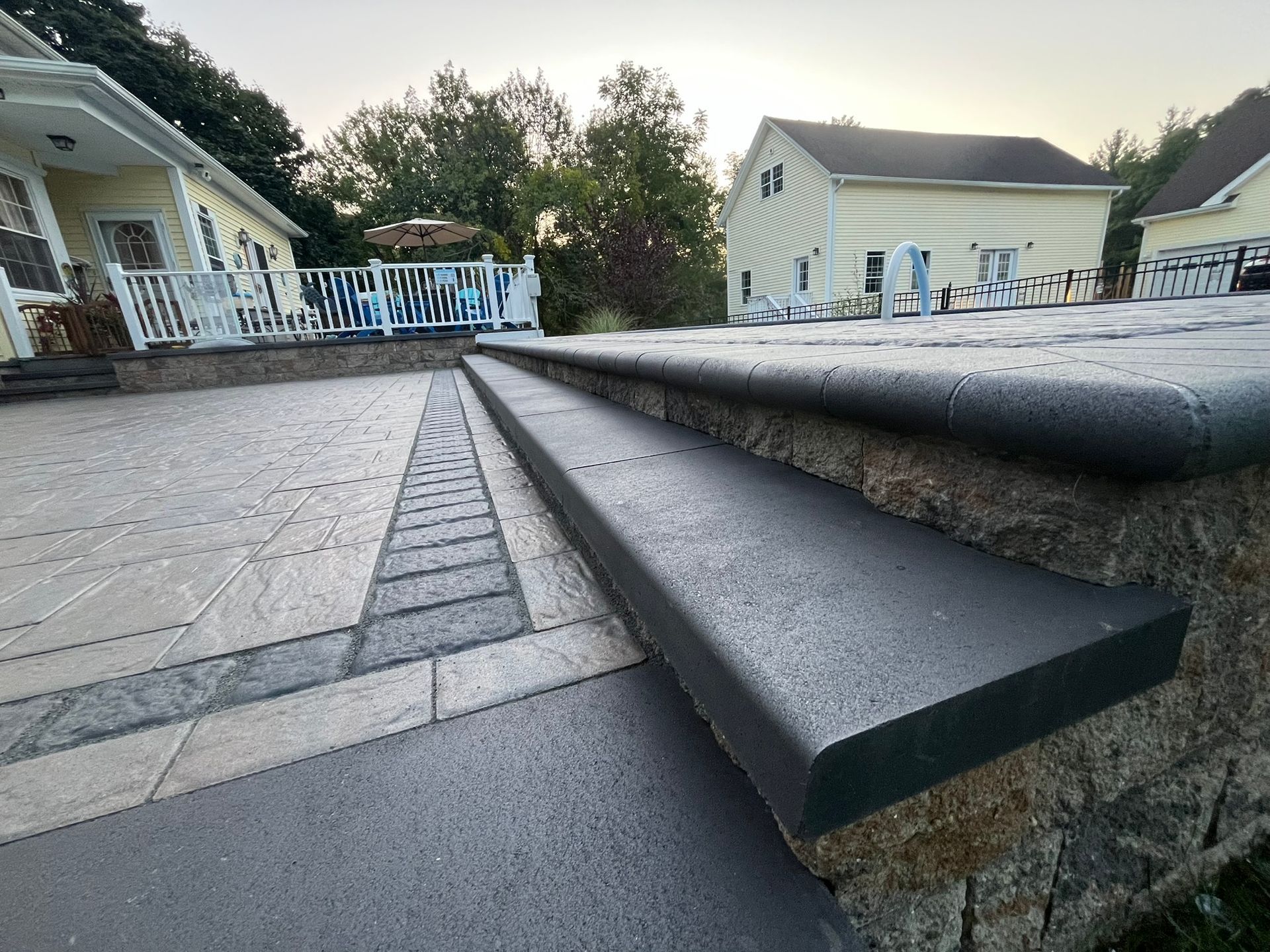 A set of stairs leading up to a pool area.