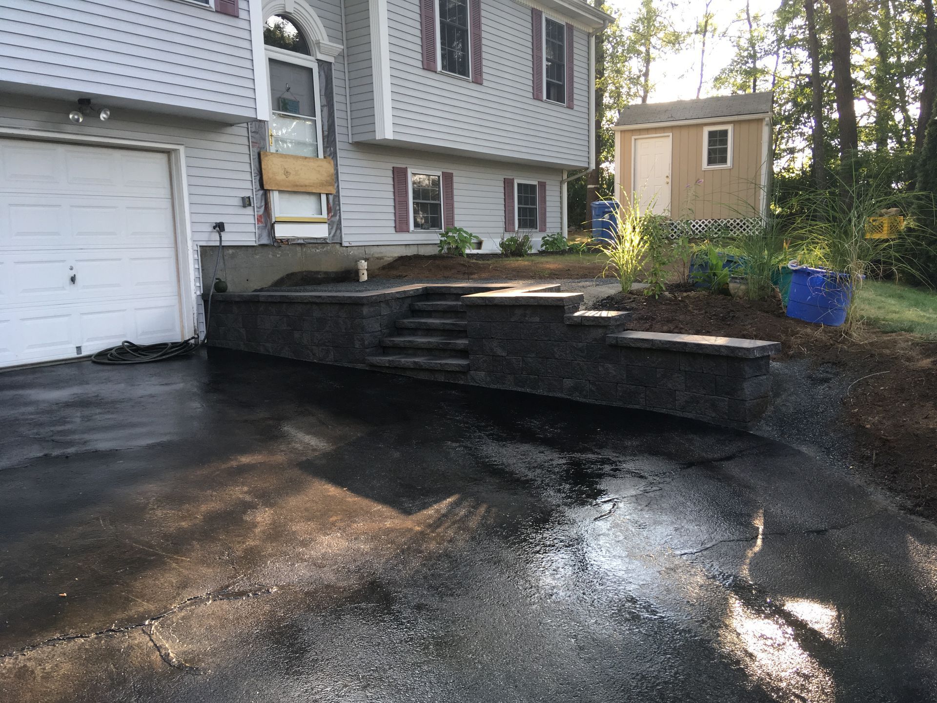 A house with a garage and stairs in front of it