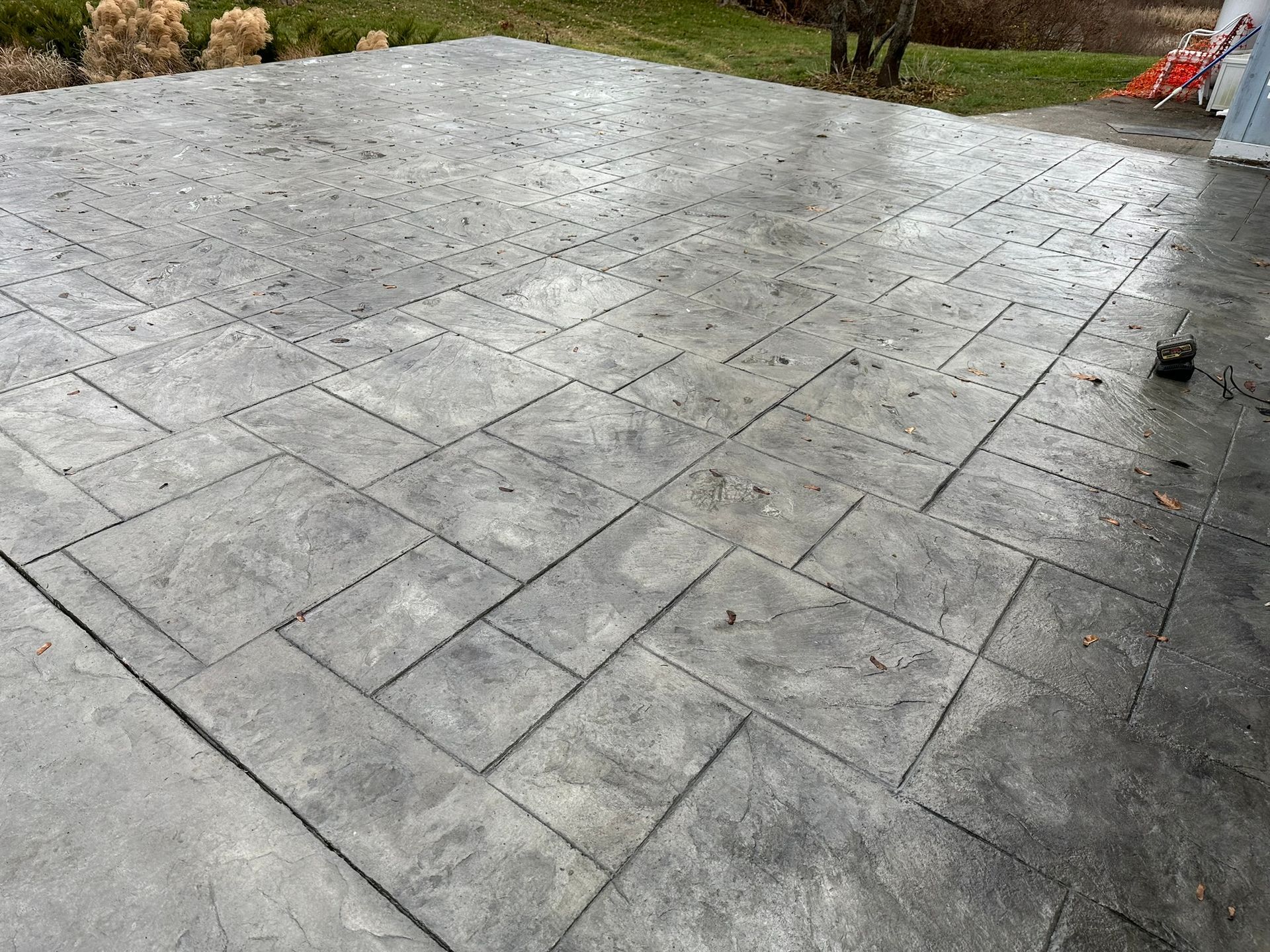 a concrete patio with a geometric pattern on it .
