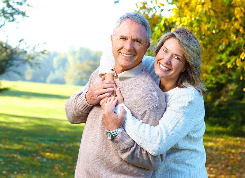 Two senior couple smiling
