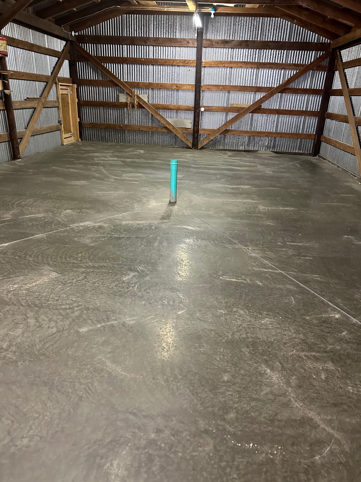 There is a blue pipe in the middle of the room.