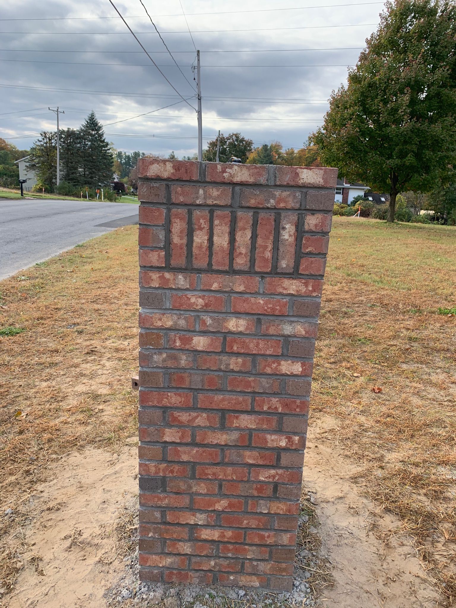 A brick wall with the word home written on it