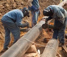 workers repairing the pipe