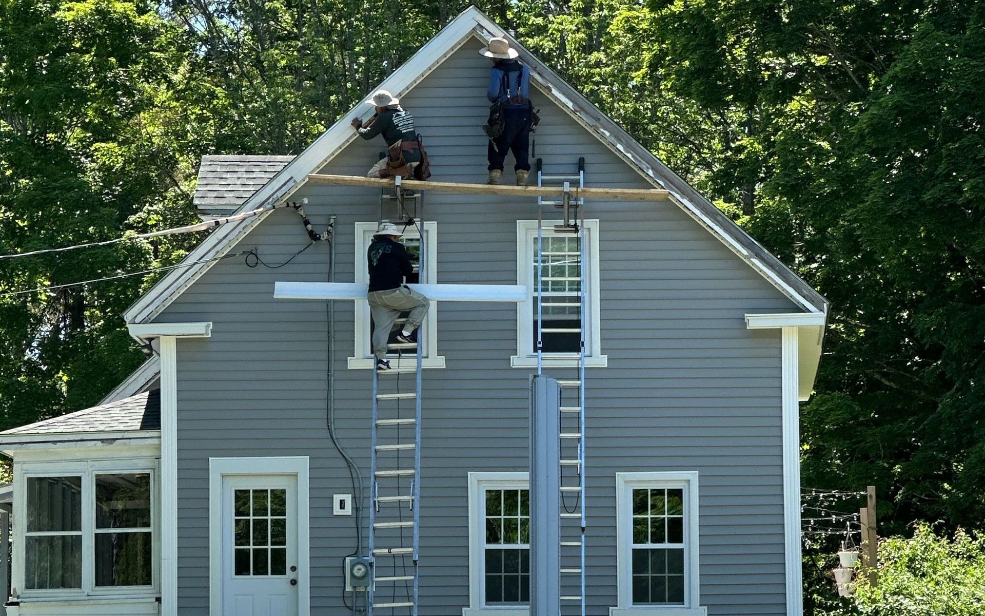 A brick chimney on top of a tiled roof