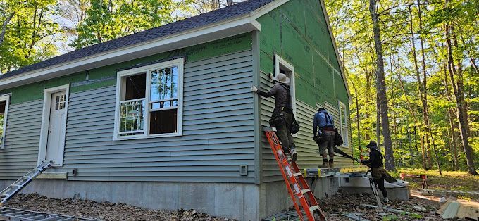 A group of men are working on a green house.
