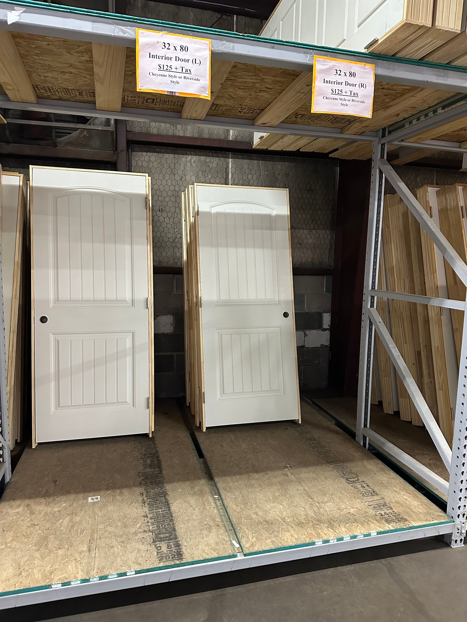 A warehouse filled with lots of boxes of doors.