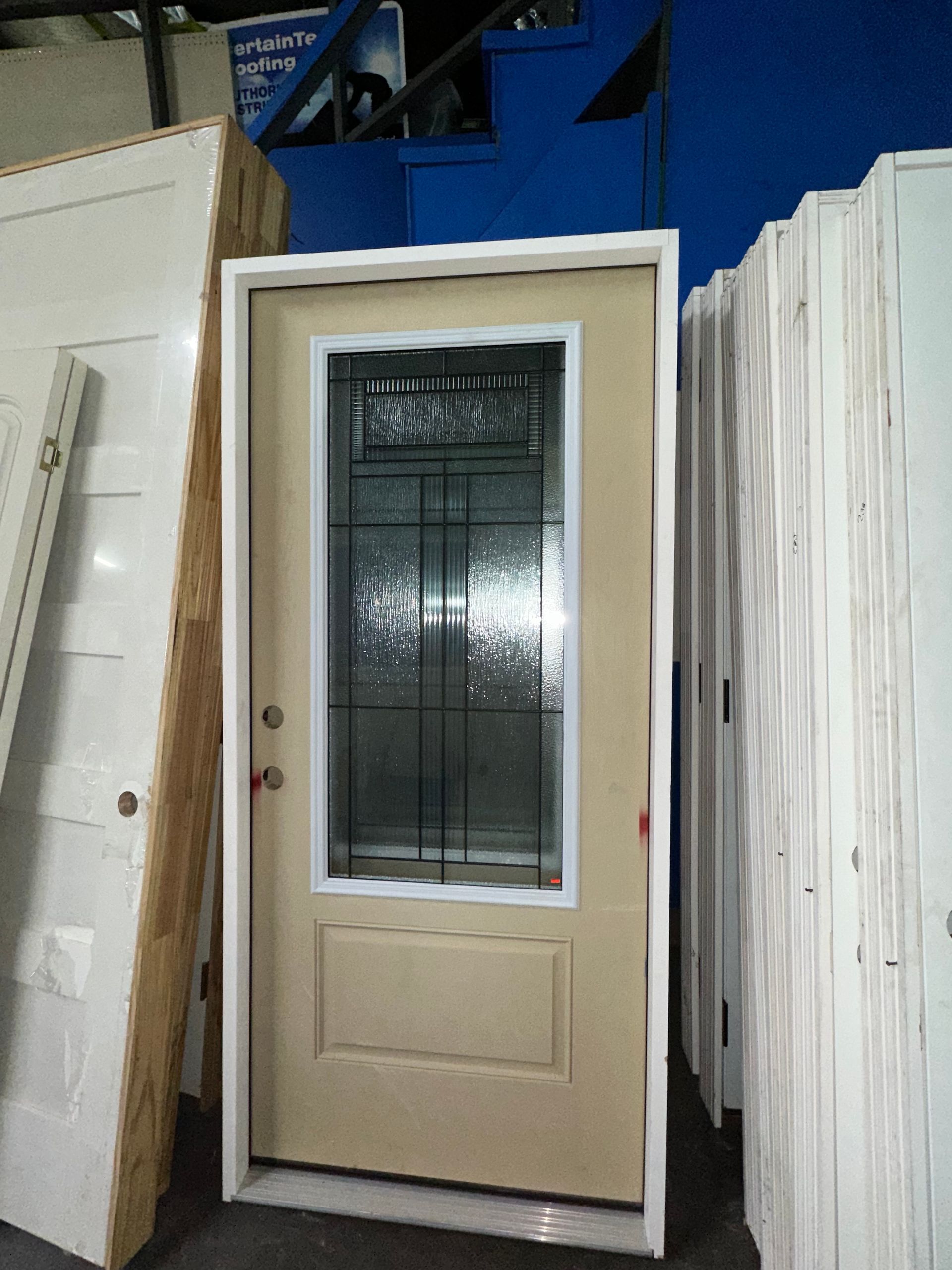 A door with a stained glass window is surrounded by other doors