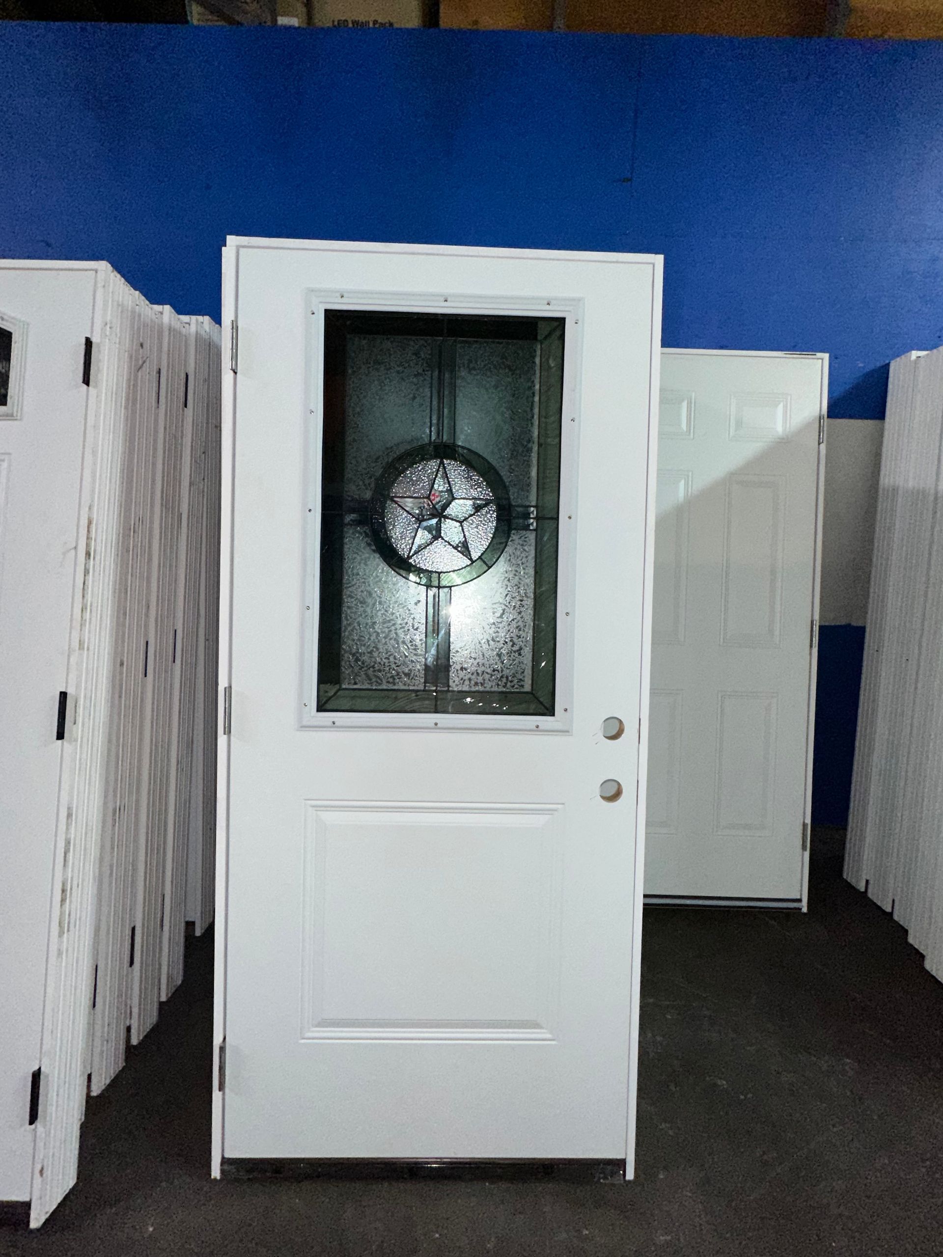 A white door with a stained glass window
