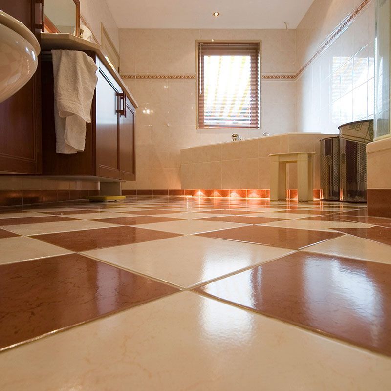 a bathroom with a checkered floor and a tub