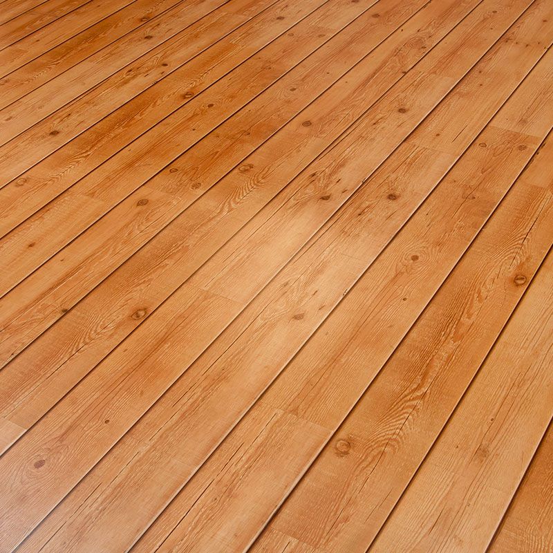 a close up of a wooden floor with a diagonal pattern