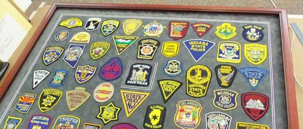 Framed police uniform patches