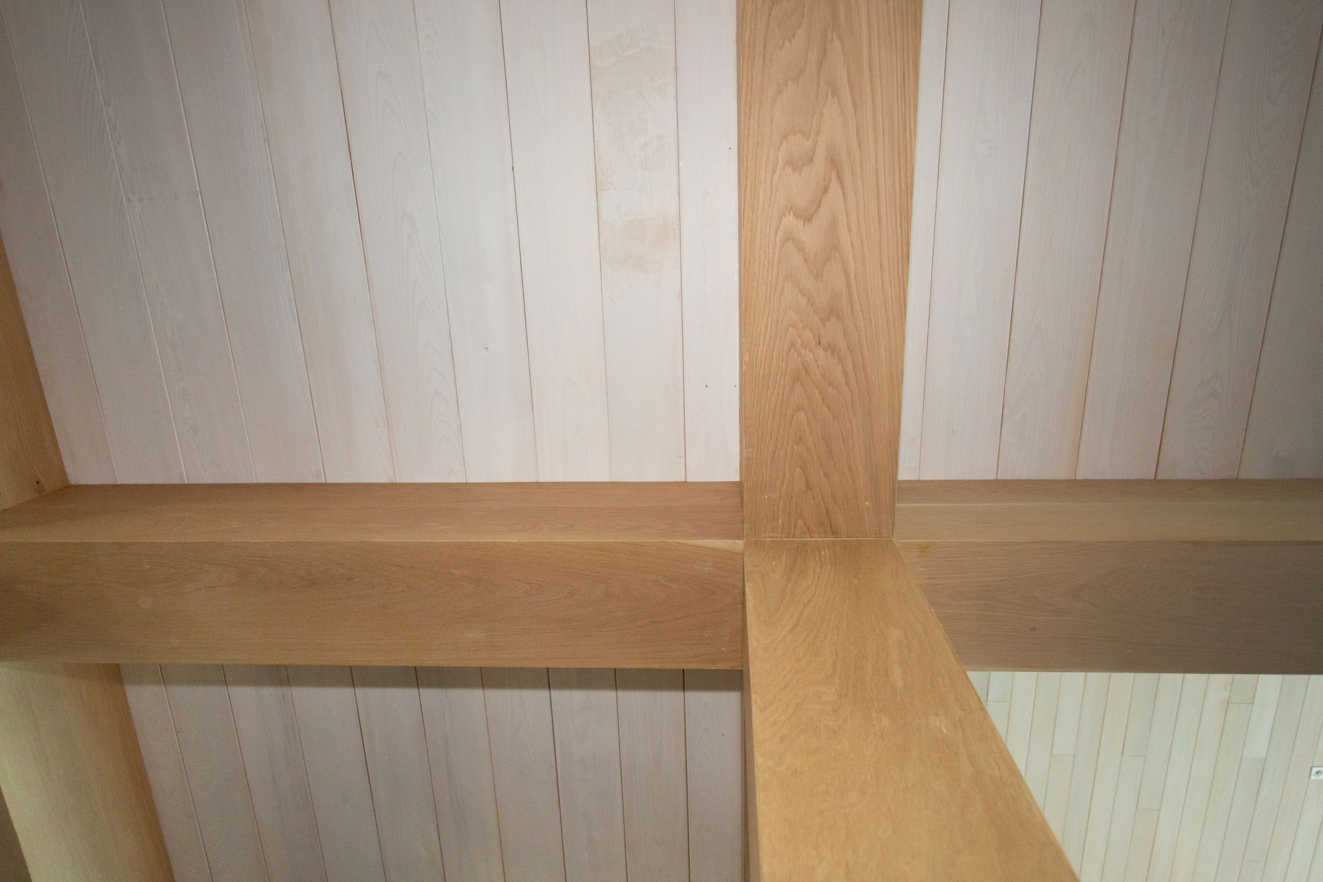 Wooden beams and ceiling panels.