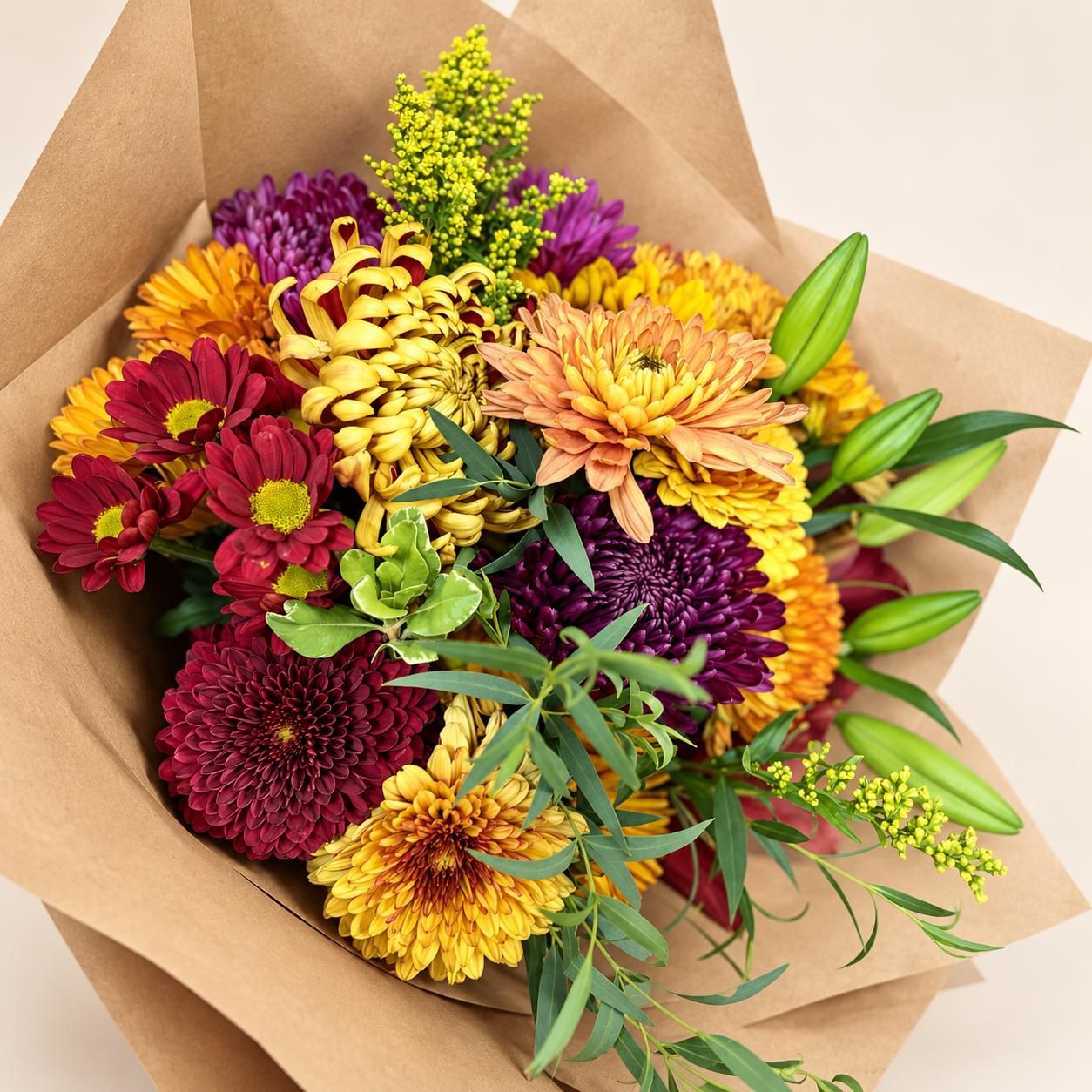 Bouquet of mixed colorful flowers in brown paper wrapping