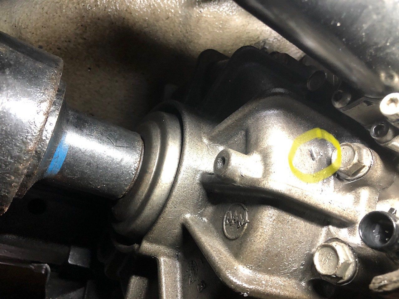 A close up of a metal object with a yellow circle around it.