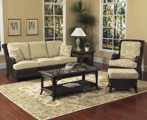 Elegant beige living room with sofa, armchair, coffee table, lamp, and patterned rug