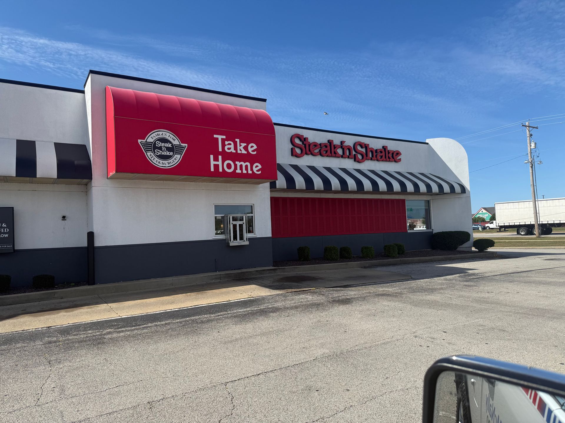 A Steak 'n Shake restaurant exterior with a red 