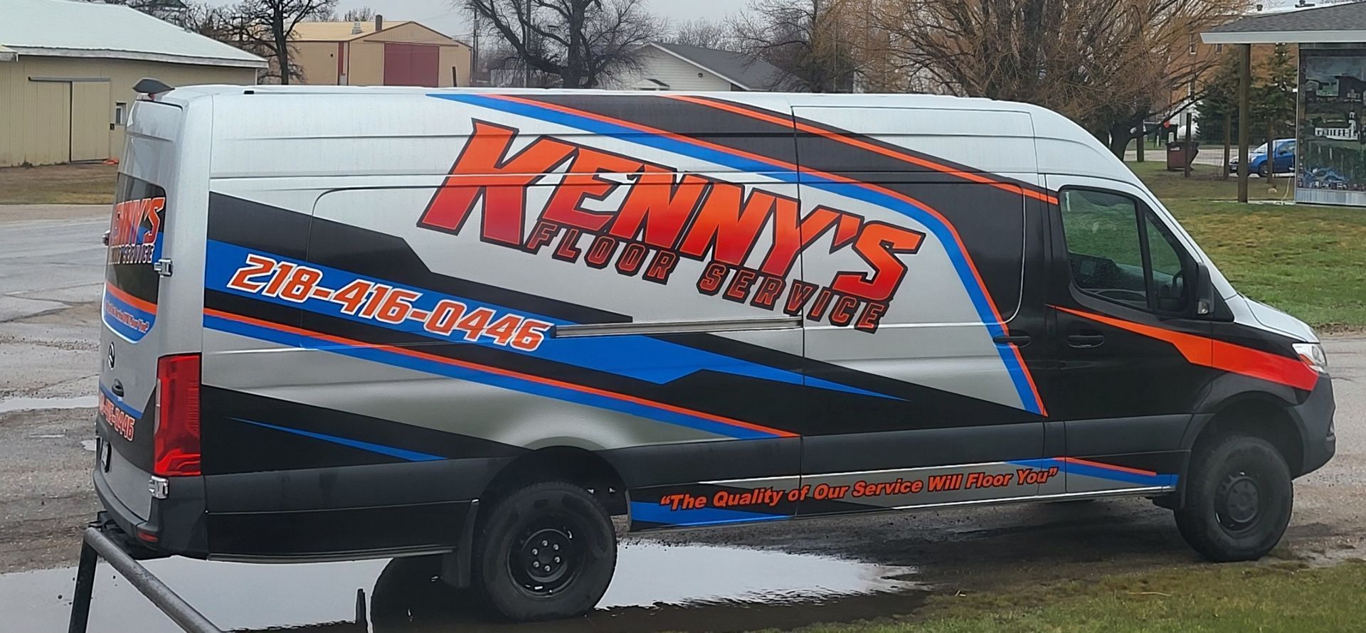 A van that says kenny 's on the side of it