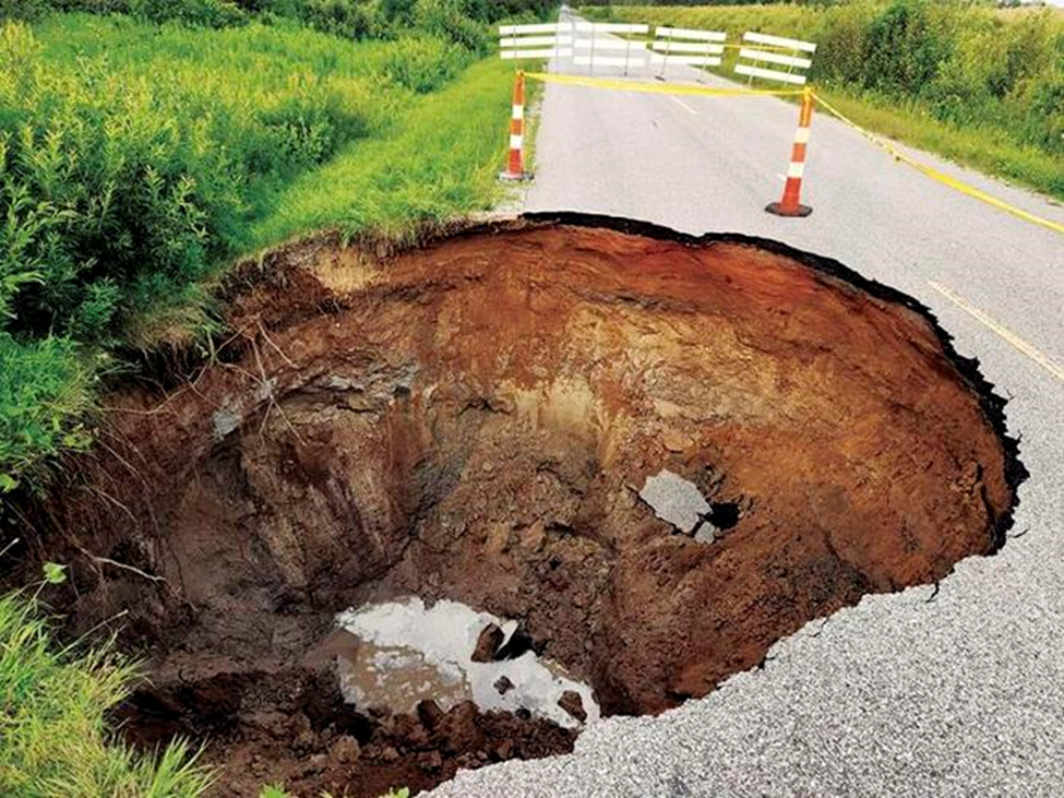 A large hole in the middle of a road