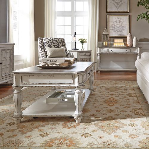 A living room with a white coffee table and a Miami chair