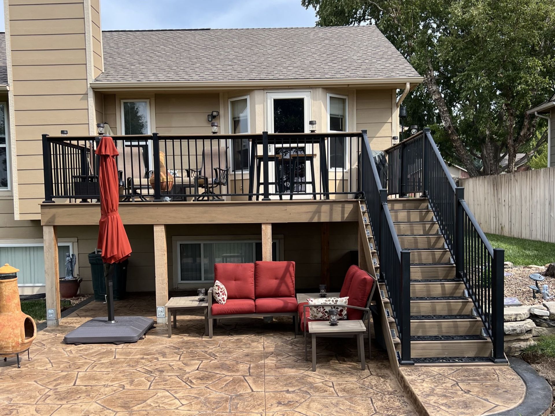 A house with a large deck and stairs leading up to it