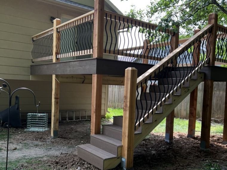 A wooden deck with stairs leading up to it