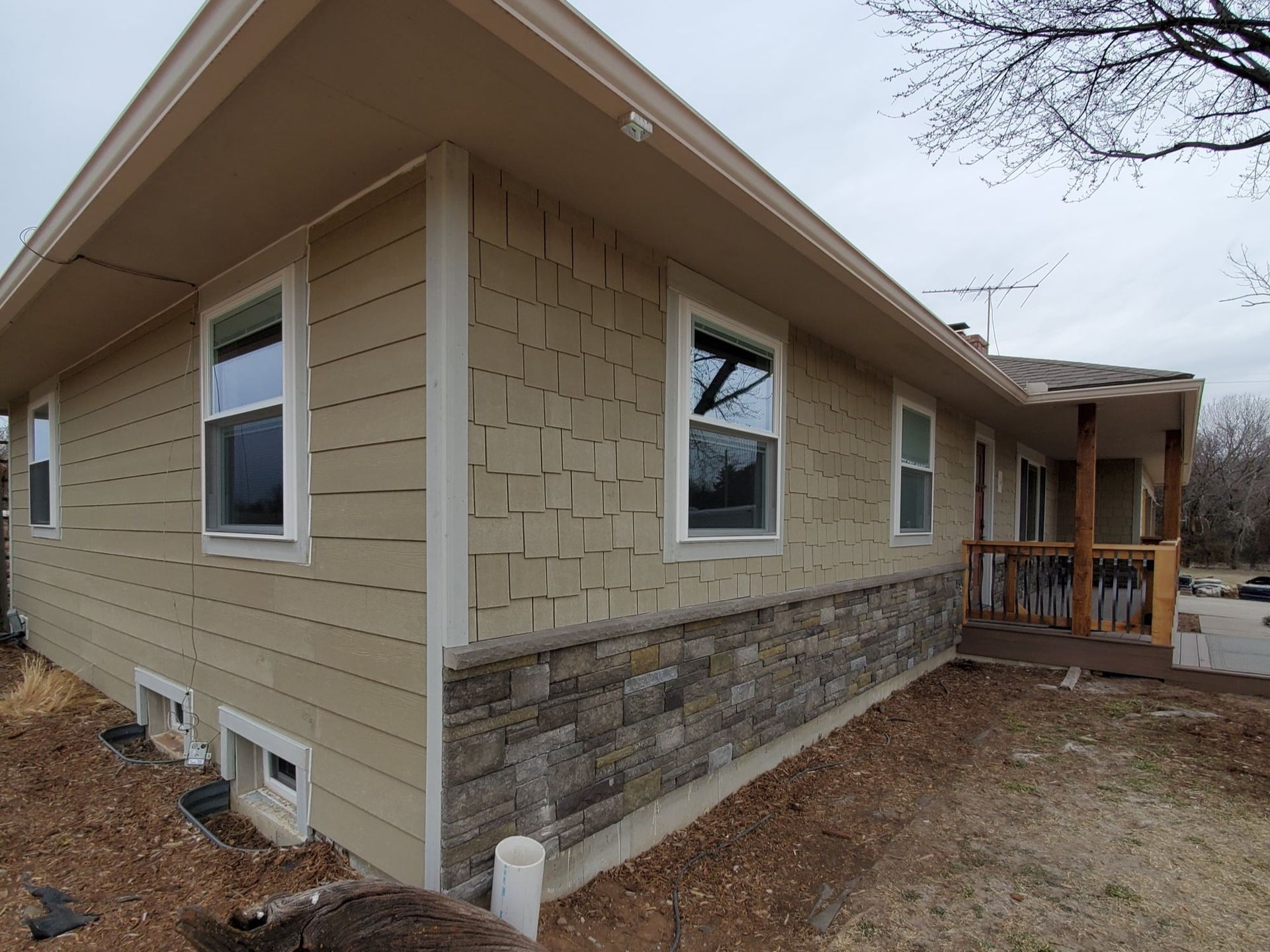 A house with a lot of windows and a porch