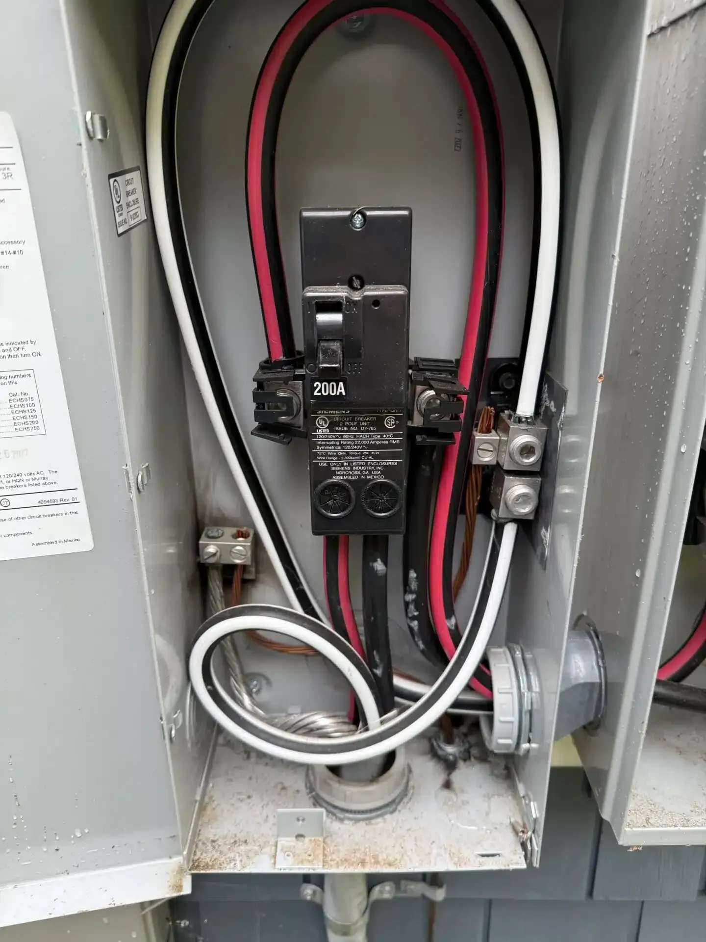 Electrical box with black, red, and white wires connected to a breaker.