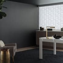 A living room with a table and chairs and a large window.