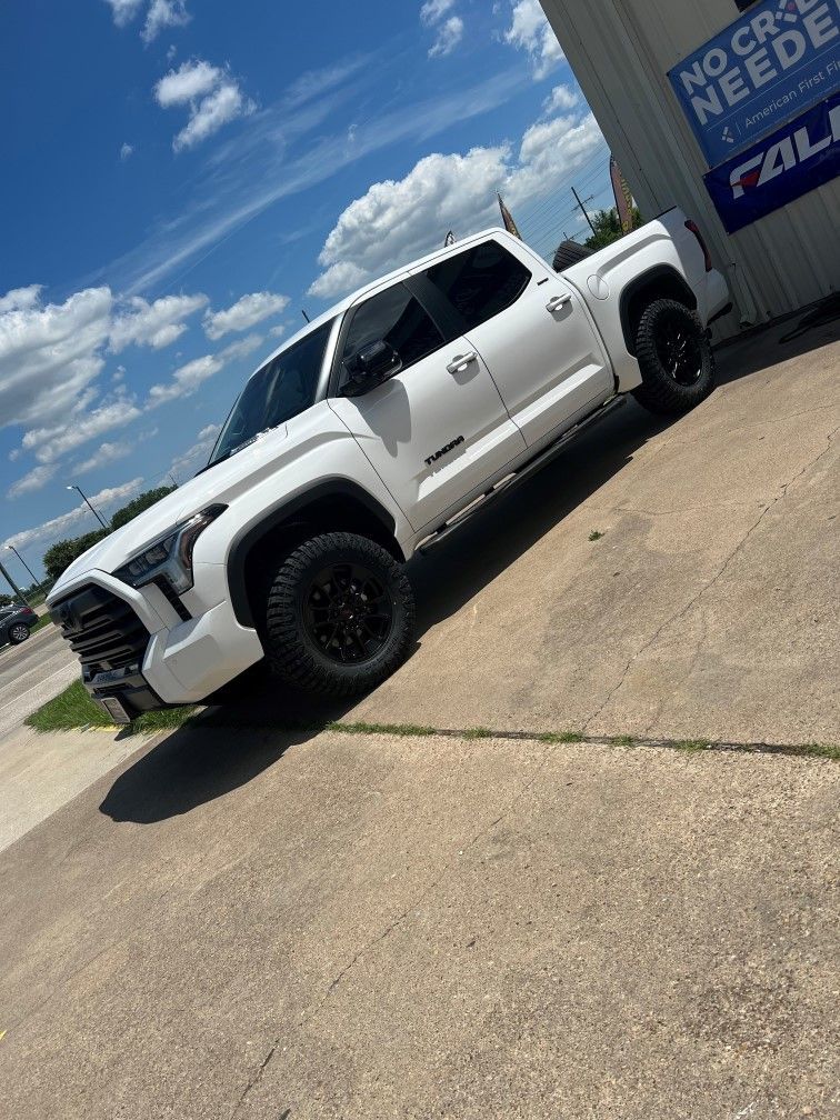 white truck outside the building
