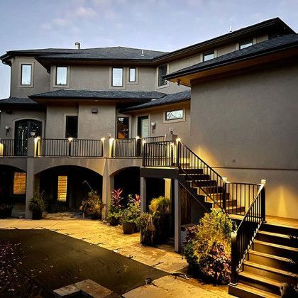 A large house with stairs leading up to it