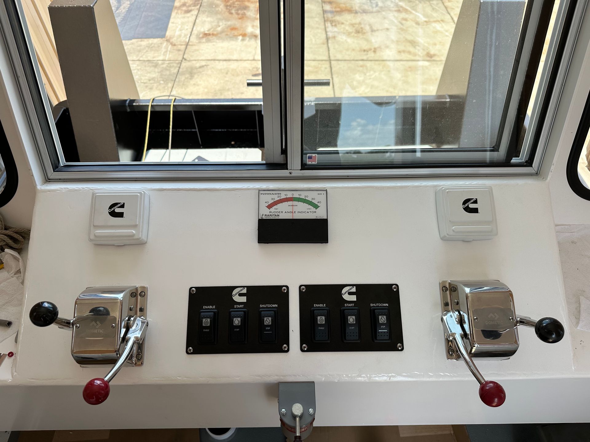 A white dashboard with a window and controls on it