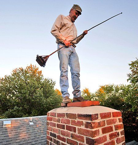 Man cleaning the chimney