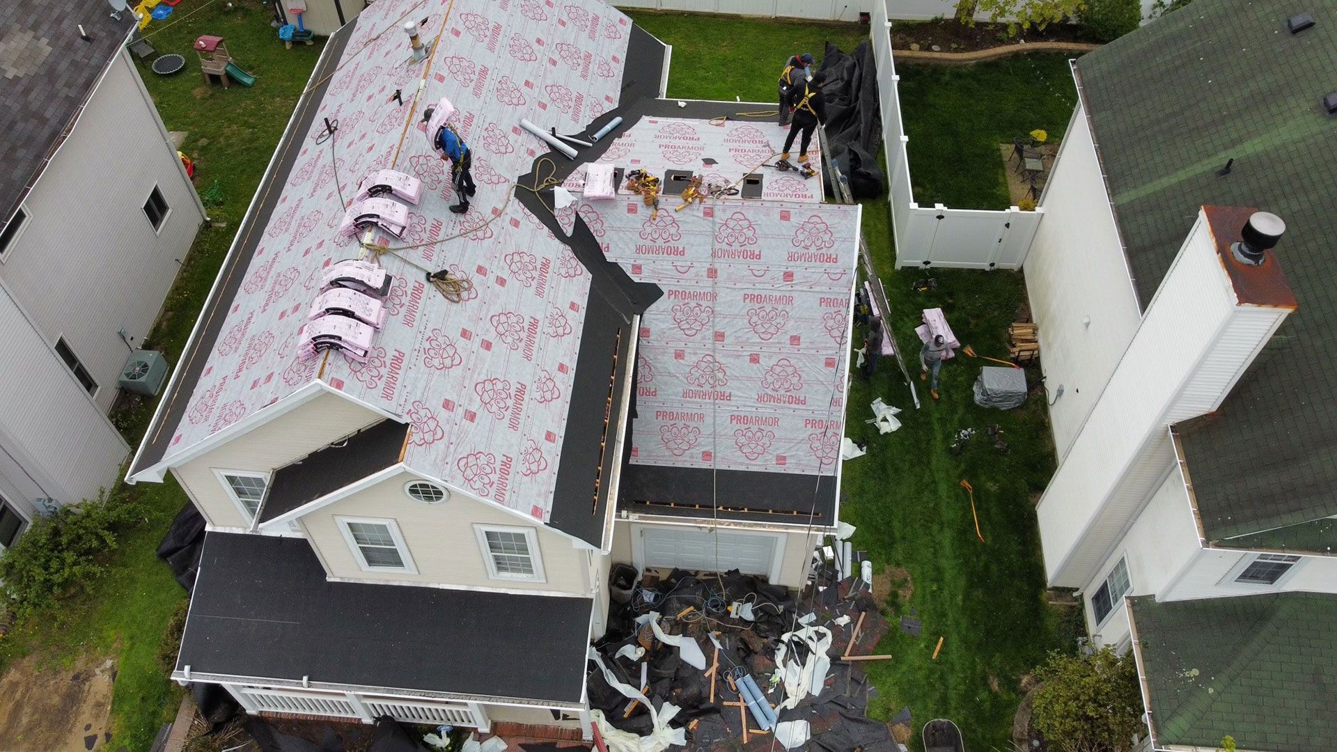 An aerial view of a house being remodeled with a new roof