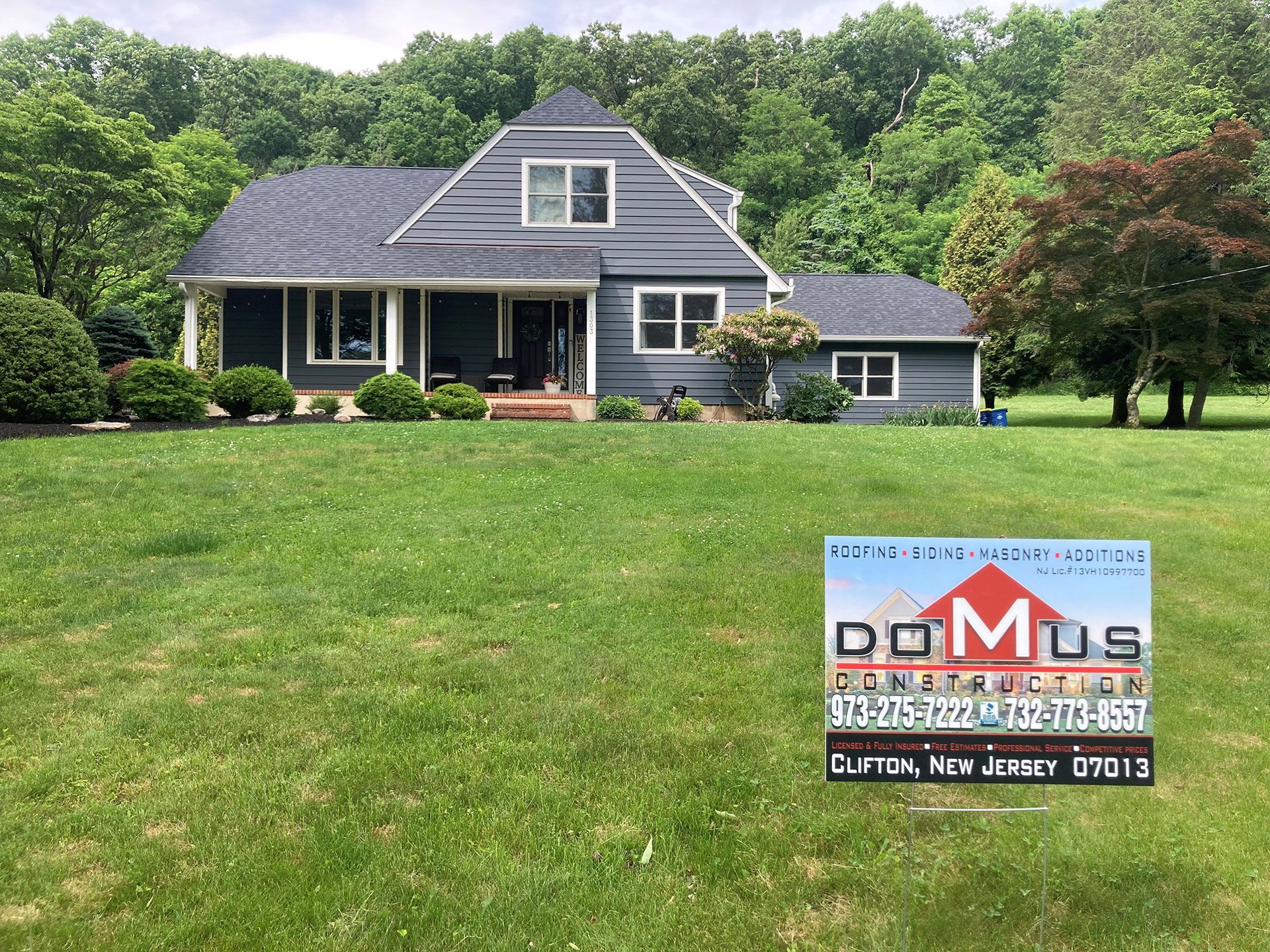 A Domus Construction sign in front of newly completed residential project