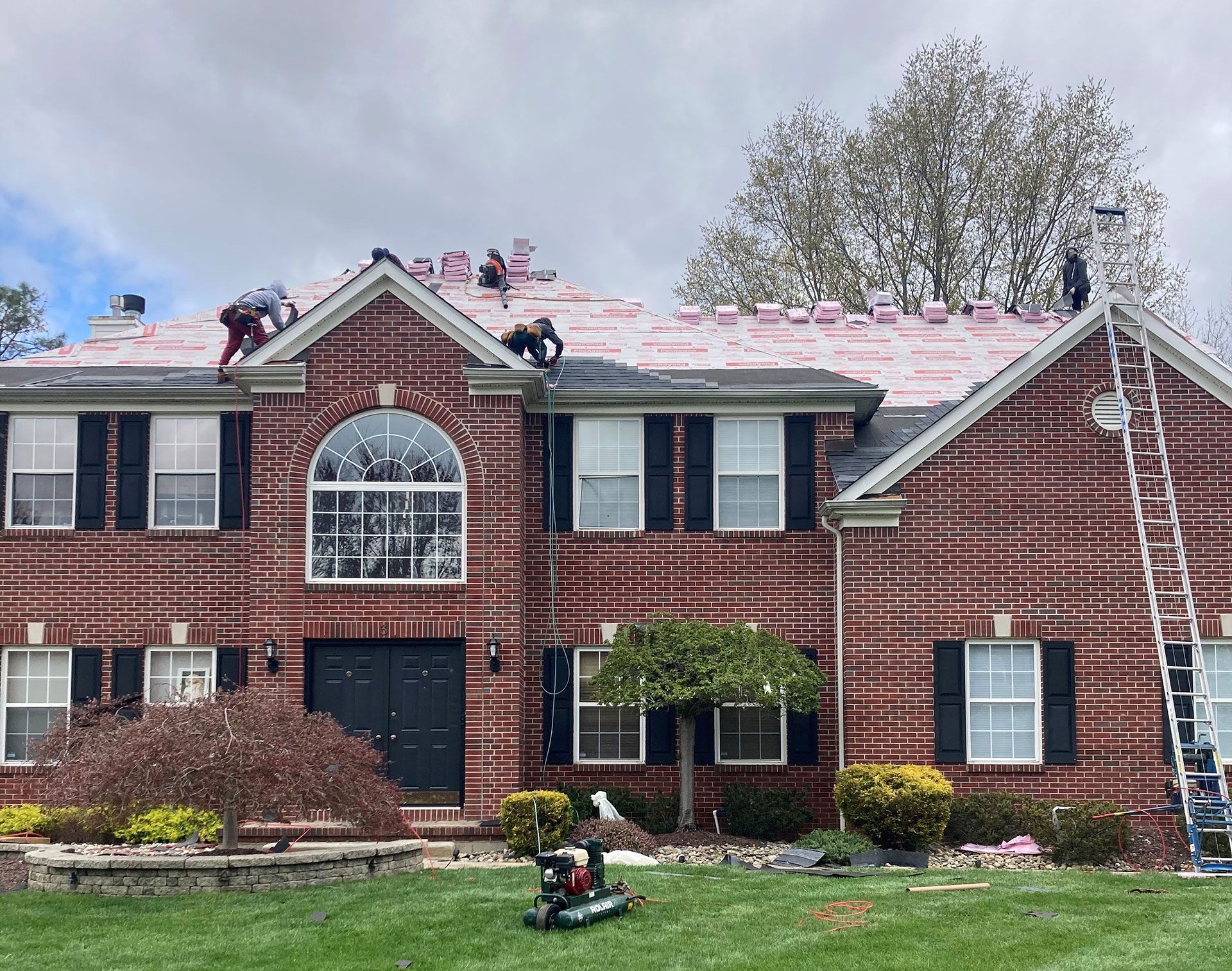 A large white house with a blue roof
