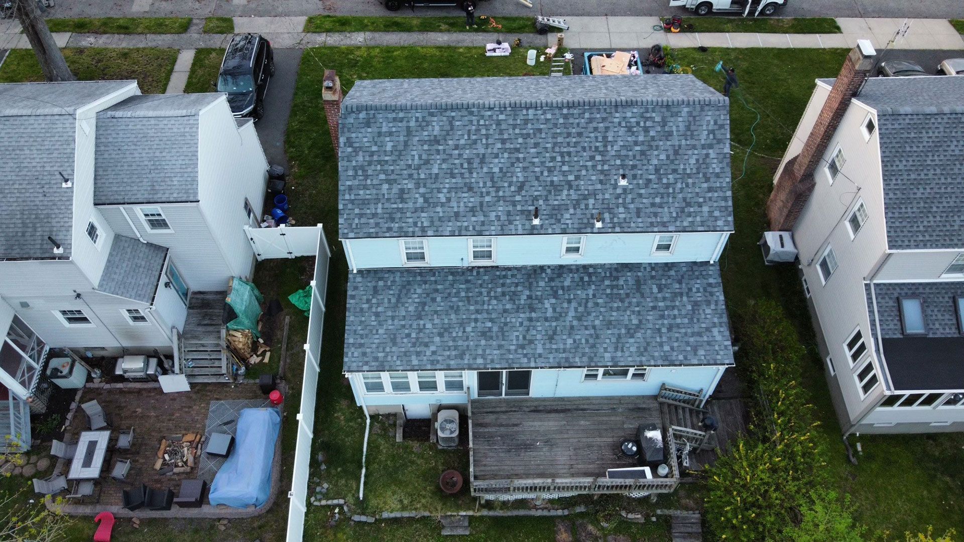 An aerial view of a row of houses in a residential neighborhood