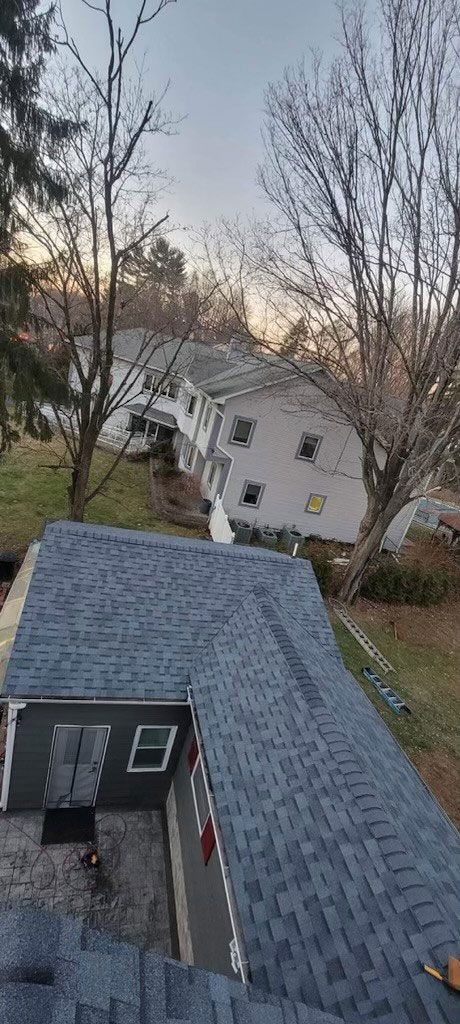 An aerial view of a house with a blue roof.